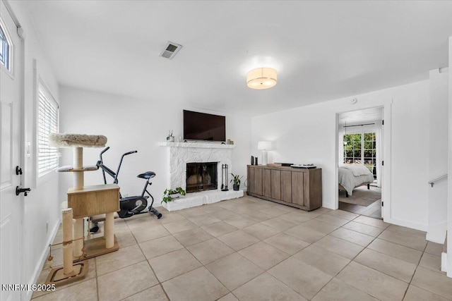 1782 Driftwood Dr, Sparks, NV 89431 - living area featuring light tile patterned flooring and a fireplace