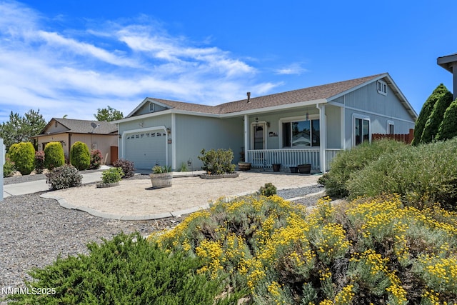 7358 Rubens Ct, Sun Valley, NV 89433 - ranch-style home with a porch, a garage, and driveway