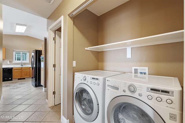 7358 Rubens Ct, Sun Valley, NV 89433 - laundry room featuring washer and clothes dryer and light tile patterned floors
