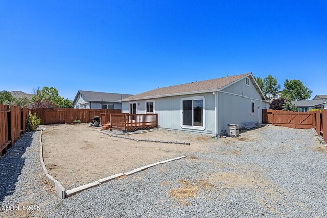 7358 Rubens Ct, Sun Valley, NV 89433 - back of house with a deck and a fenced backyard