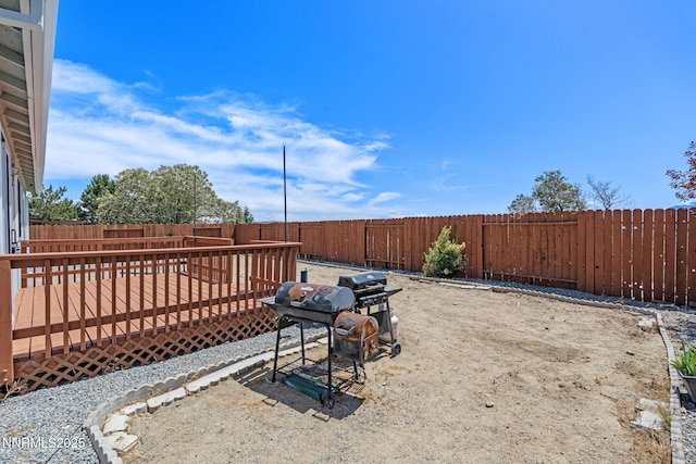 7358 Rubens Ct, Sun Valley, NV 89433 - fenced backyard featuring a wooden deck