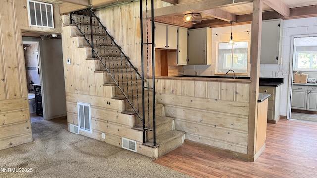 157 Cottonwood Dr, Stateline, NV 89449 - kitchen with light wood-style flooring, beam ceiling, and dark countertops
