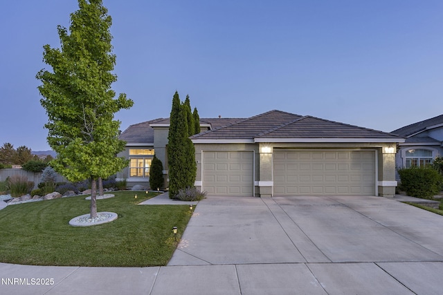 1660 Murrieta Ct, Reno, NV 89521 - view of front facade with driveway, a garage, a front lawn, a tile roof, and stucco siding