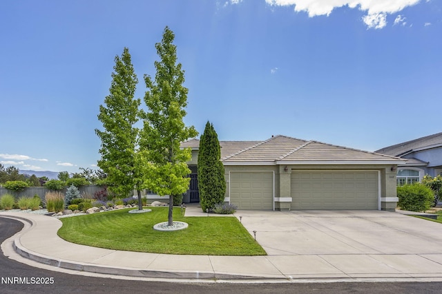 1660 Murrieta Ct, Reno, NV 89521 - view of front facade featuring a garage, concrete driveway, a tiled roof, and stucco siding