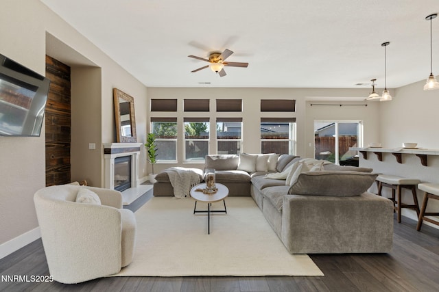 10265 Donnay Ct, Reno, NV 89521 - living room with plenty of natural light, ceiling fan, a glass covered fireplace, and dark wood finished floors