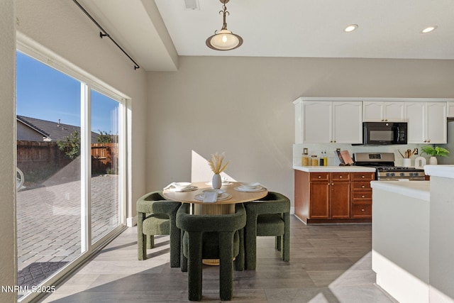 10265 Donnay Ct, Reno, NV 89521 - dining room with wood finished floors and recessed lighting