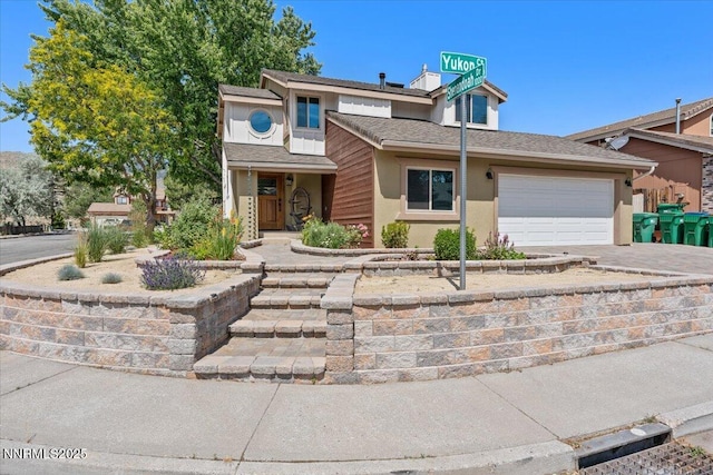 4710 Yukon Ct, Carson City, NV 89706 - view of front of property with driveway, a garage, and stucco siding