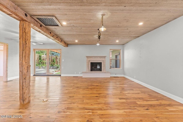 4710 Yukon Ct, Carson City, NV 89706 - unfurnished living room with light wood-style floors, wood ceiling, a glass covered fireplace, and recessed lighting