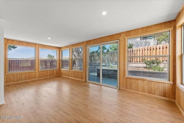 4710 Yukon Ct, Carson City, NV 89706 - unfurnished sunroom featuring wood finished floors, wooden walls, and recessed lighting