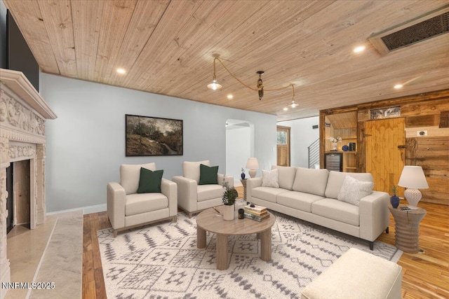 4710 Yukon Ct, Carson City, NV 89706 - living room with wood ceiling, recessed lighting, arched walkways, a fireplace, and beverage cooler