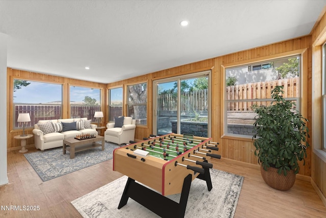 4710 Yukon Ct, Carson City, NV 89706 - playroom with wooden walls, plenty of natural light, wood finished floors, and recessed lighting