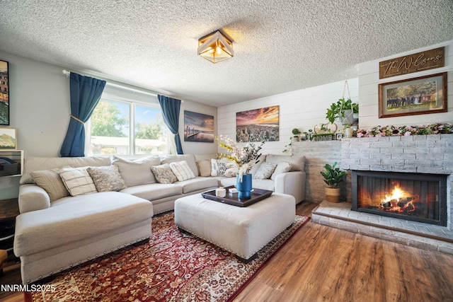 1165 Autumn Hills Dr, Reno, NV 89511 - living room featuring wood finished floors, a textured ceiling, and a fireplace
