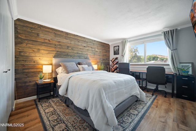 1165 Autumn Hills Dr, Reno, NV 89511 - bedroom with wood finished floors, wooden walls, and crown molding