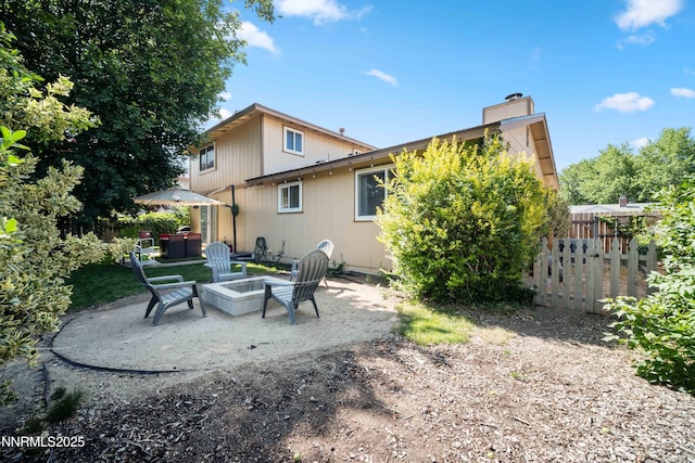 1165 Autumn Hills Dr, Reno, NV 89511 - back of house featuring a patio area, a fire pit, and a chimney