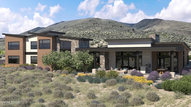 6832 Rabbit Brush Ct, Reno, NV 89511 - rear view of property featuring a mountain view, stone siding, a chimney, and outdoor lounge area