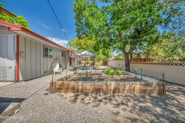80 Strawberry Ln, Reno, NV 89509 - view of yard with a vegetable garden