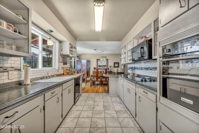 80 Strawberry Ln, Reno, NV 89509 - kitchen featuring open shelves, black appliances, backsplash, dark countertops, and decorative light fixtures