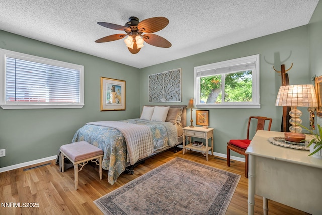 80 Strawberry Ln, Reno, NV 89509 - bedroom with a textured ceiling, wood finished floors, and ceiling fan