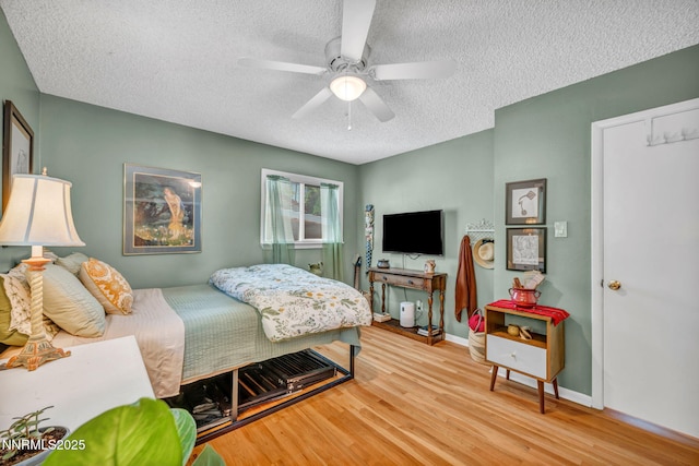 80 Strawberry Ln, Reno, NV 89509 - bedroom featuring a textured ceiling, wood finished floors, and ceiling fan