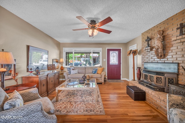 80 Strawberry Ln, Reno, NV 89509 - living room featuring light wood finished floors, a ceiling fan, and a textured ceiling