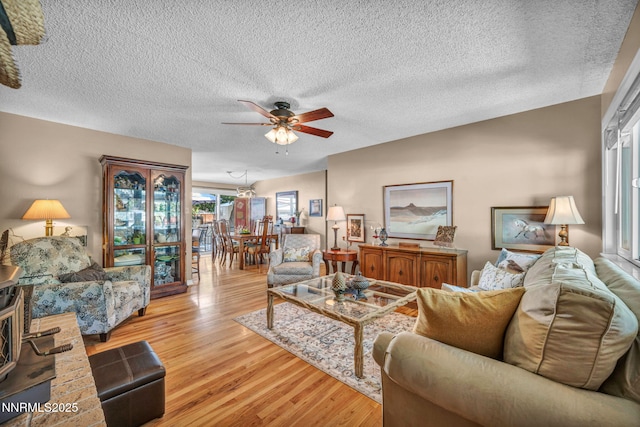 80 Strawberry Ln, Reno, NV 89509 - living room featuring ceiling fan, light wood finished floors, and a textured ceiling