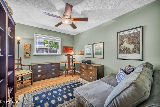 80 Strawberry Ln, Reno, NV 89509 - office area with ceiling fan, a textured ceiling, and wood finished floors