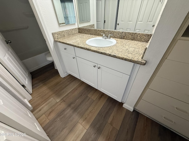 2450 Lymbery St Unit 228, Reno, NV 89509 - bathroom with vanity, wood finished floors, and  shower combination