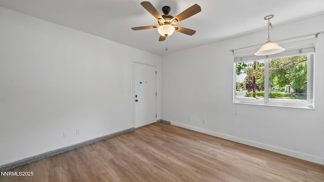 908 E Robinson St, Carson City, NV 89701 - unfurnished room featuring wood finished floors and ceiling fan