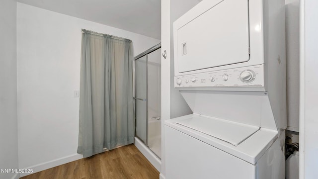 908 E Robinson St, Carson City, NV 89701 - laundry room with stacked washer / drying machine and light wood-type flooring