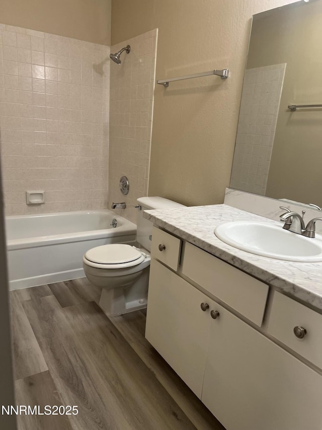 2955 Lakeside Dr Unit 108, Reno, NV 89509 - full bath with vanity, washtub / shower combination, and wood finished floors