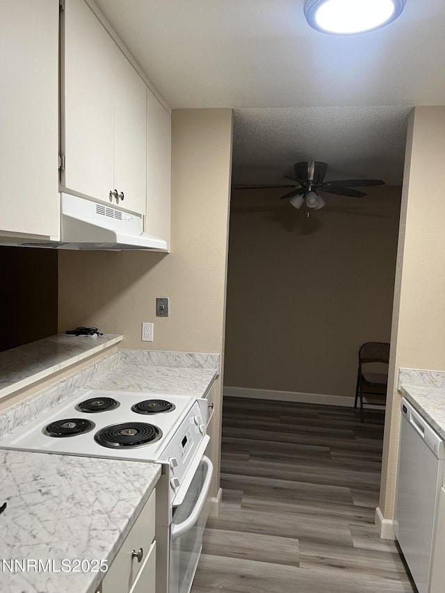 2955 Lakeside Dr Unit 108, Reno, NV 89509 - kitchen with white appliances, under cabinet range hood, ceiling fan, light countertops, and white cabinets