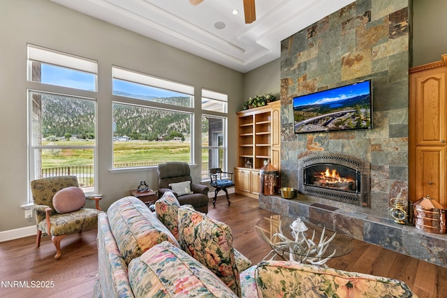 2548 Genoa Aspen Dr, Genoa, NV 89411 - living room featuring a fireplace, wood finished floors, and a ceiling fan