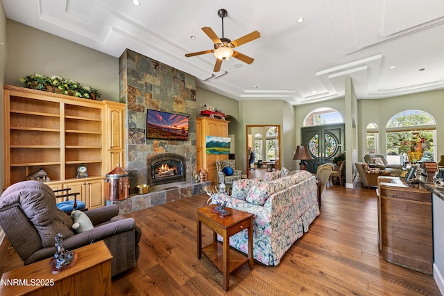 2548 Genoa Aspen Dr, Genoa, NV 89411 - living area with ceiling fan, a fireplace, wood finished floors, recessed lighting, and a tray ceiling