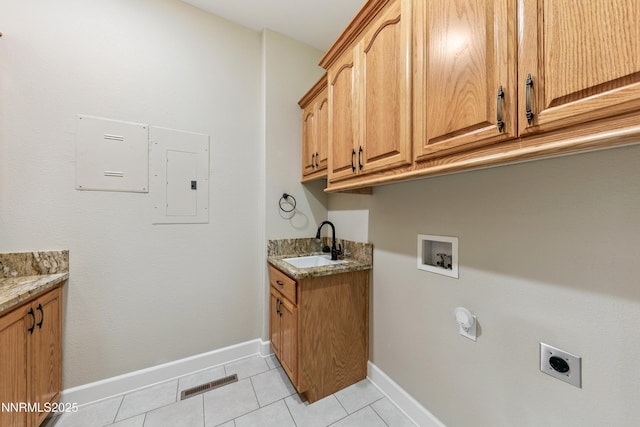 2548 Genoa Aspen Dr, Genoa, NV 89411 - laundry room featuring hookup for an electric dryer, electric panel, cabinet space, light tile patterned floors, and washer hookup
