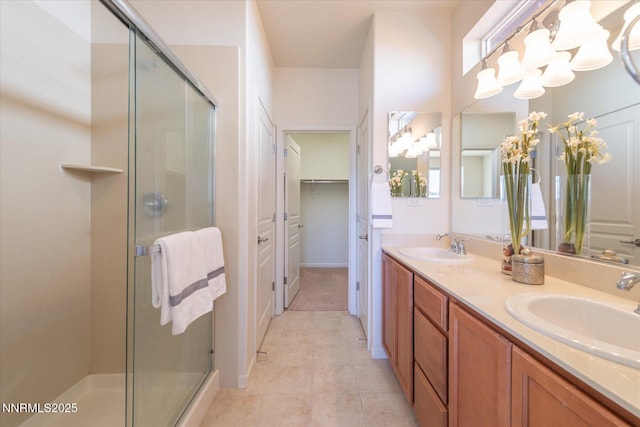 1160 Sugar Creek Trl, Reno, NV 89523 - full bathroom with a chandelier, a shower stall, double vanity, a walk in closet, and tile patterned floors