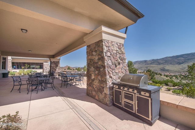 1160 Sugar Creek Trl, Reno, NV 89523 - view of patio featuring exterior kitchen, a mountain view, and outdoor dining area