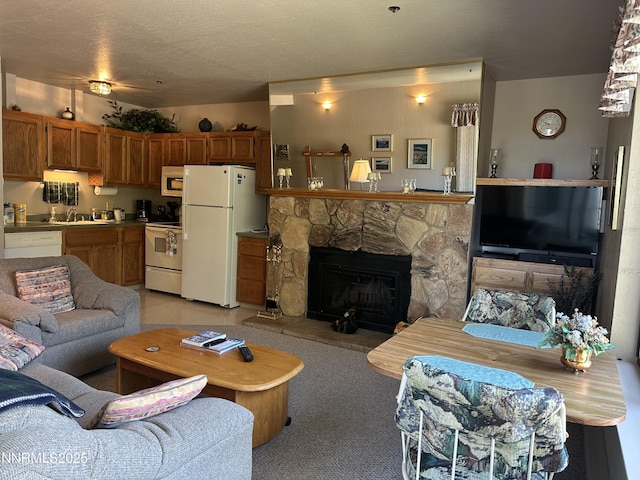 313 Tramway Dr Unit 20, Stateline, NV 89449 - living area featuring a stone fireplace and light colored carpet