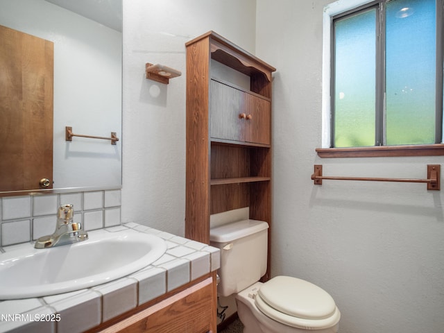 1561 Alba Vis, Gardnerville, NV 89410 - bathroom featuring vanity, tasteful backsplash, and a textured wall