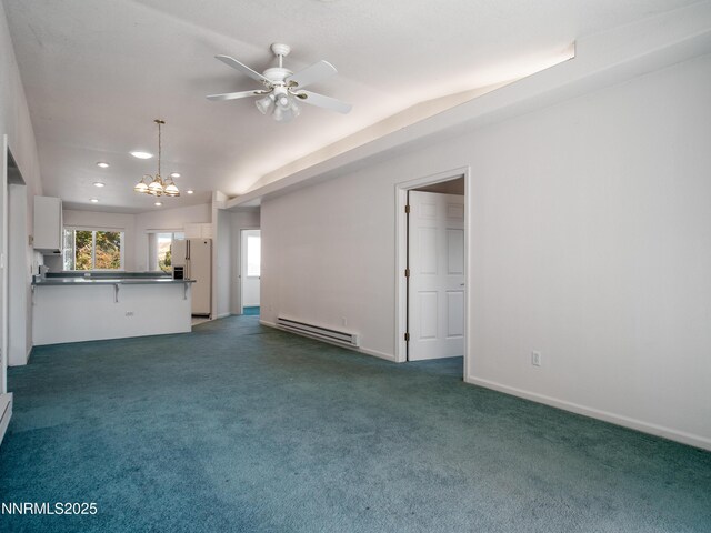 1561 Alba Vis, Gardnerville, NV 89410 - unfurnished living room featuring baseboard heating, a chandelier, ceiling fan, lofted ceiling, and carpet