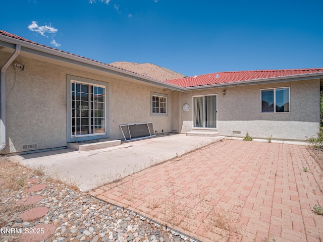 1561 Alba Vis, Gardnerville, NV 89410 - rear view of property featuring stucco siding, a patio, and crawl space
