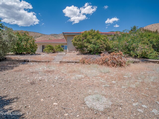 1561 Alba Vis, Gardnerville, NV 89410 - view of front of property featuring a tile roof, stucco siding, and a mountain view