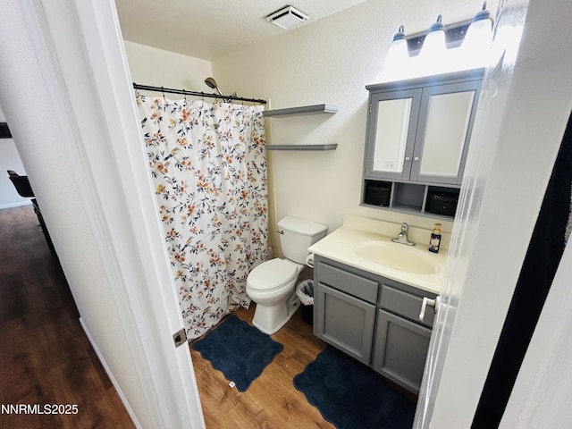 1442 Spooner Dr, Carson City, NV 89706 - bathroom with wood finished floors, vanity, and a shower with curtain