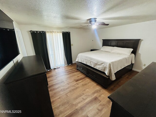 1442 Spooner Dr, Carson City, NV 89706 - bedroom with a textured ceiling, light wood-type flooring, and ceiling fan