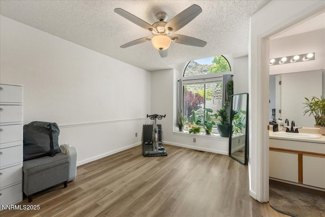 4318 Leeward Ln, Reno, NV 89502 - unfurnished room with a textured ceiling, wood finished floors, and a ceiling fan
