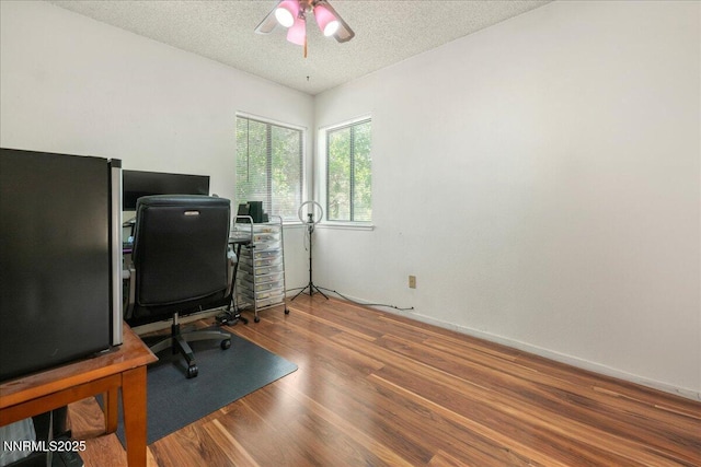 4318 Leeward Ln, Reno, NV 89502 - home office featuring a ceiling fan, a textured ceiling, and wood finished floors