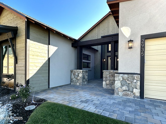 2935 Portrush Dr, Genoa, NV 89411 - property entrance with stucco siding and a patio area
