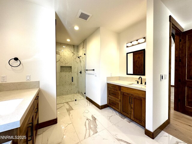 2935 Portrush Dr, Genoa, NV 89411 - full bathroom featuring two vanities, a marble finish shower, marble finish floors, and recessed lighting