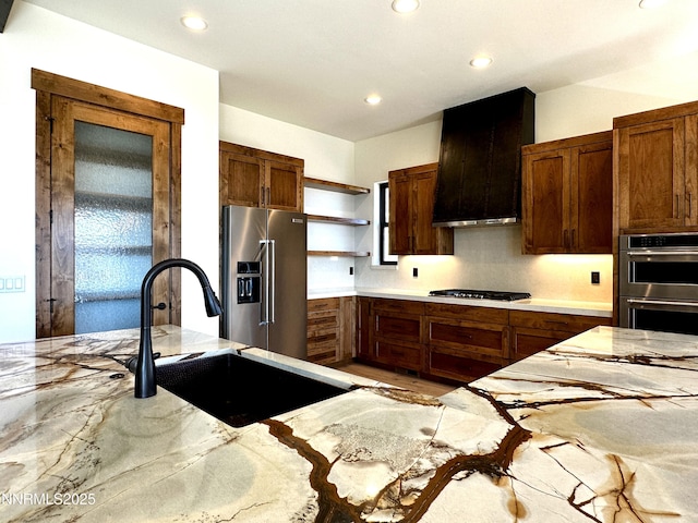 2935 Portrush Dr, Genoa, NV 89411 - kitchen featuring stainless steel appliances, open shelves, exhaust hood, recessed lighting, and light stone counters