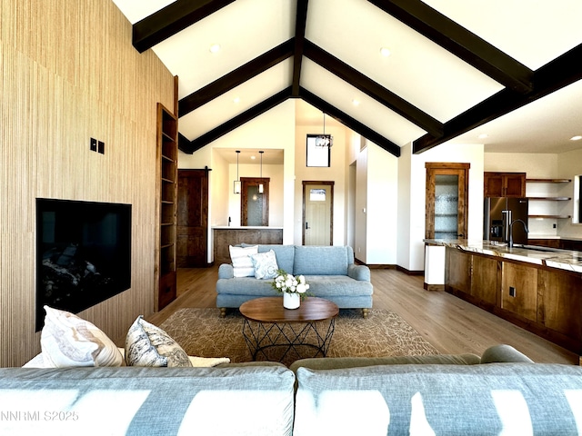 2935 Portrush Dr, Genoa, NV 89411 - living area featuring dark wood-style floors, beamed ceiling, and high vaulted ceiling