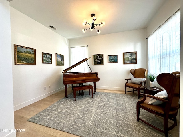 5454 Side Saddle Trl, Reno, NV 89511 - sitting room featuring plenty of natural light, a chandelier, and wood finished floors